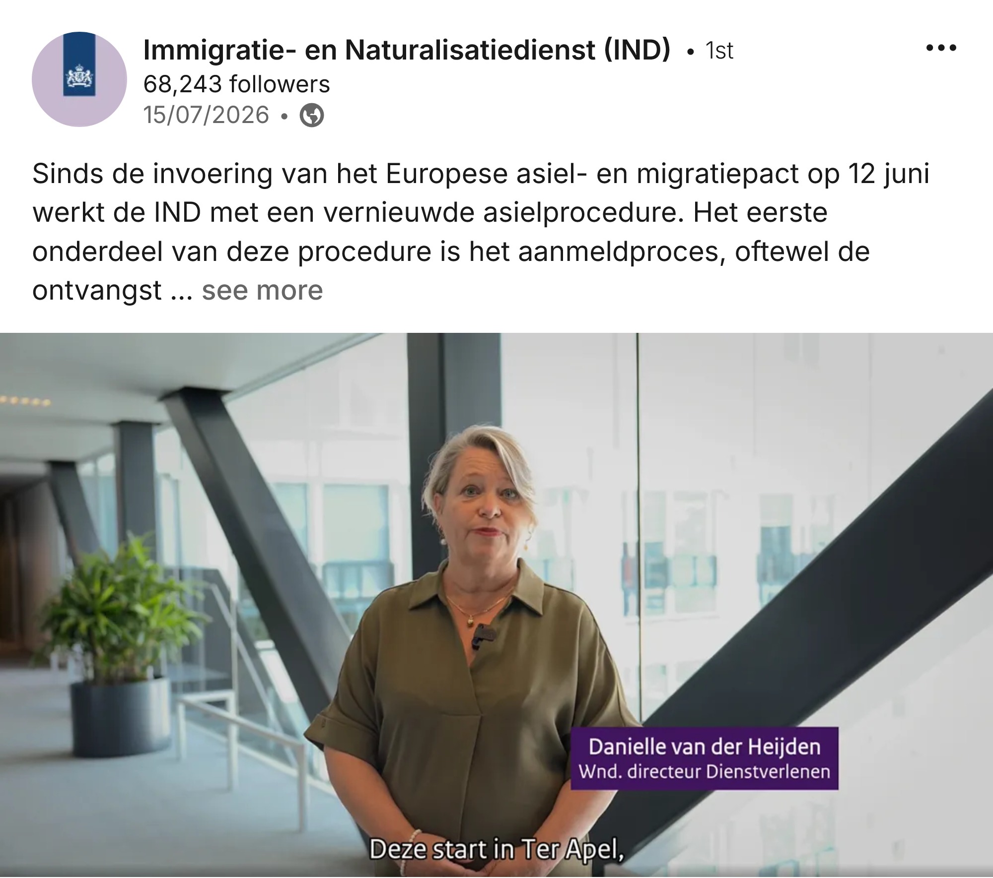 Video still: Danielle van der Heijden, acting director of Services at the IND, speaking in a light office atrium. On-screen subtitle reads 